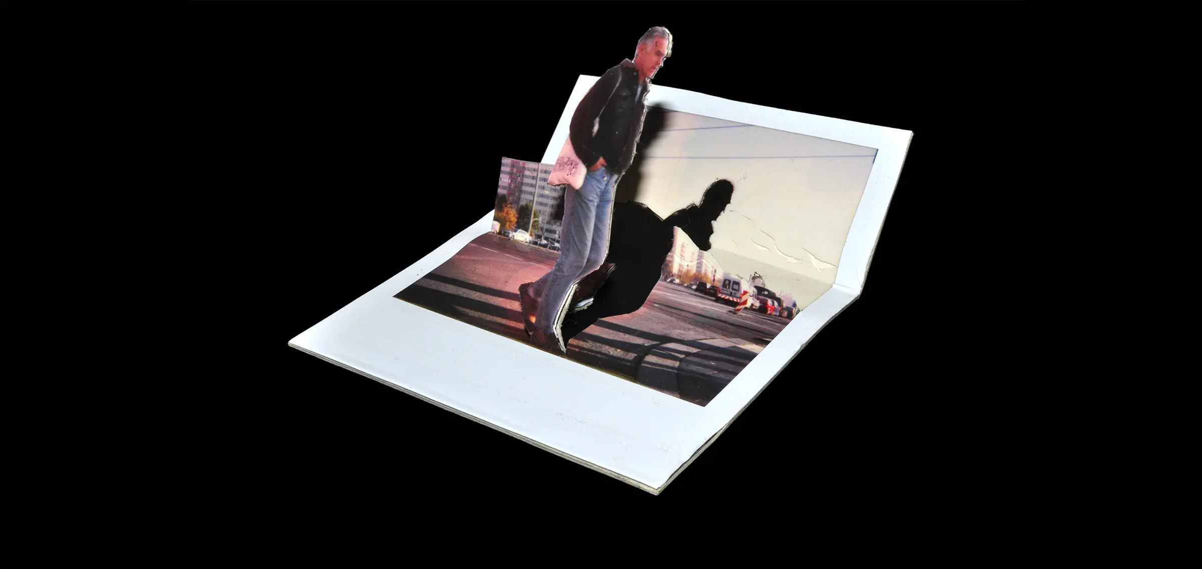 Person standing next to a crossing and cut along their contour out of the Polaroid image.
