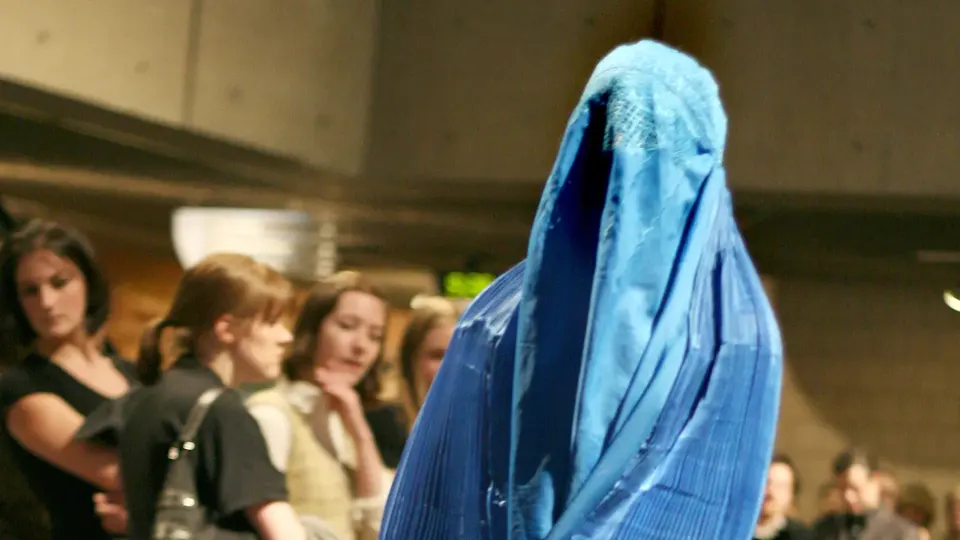 A person wearing a burka during a fashion show